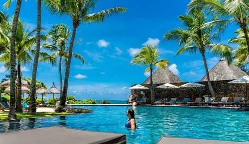 Girl enjoying Hotel turquoise Pool near the sea