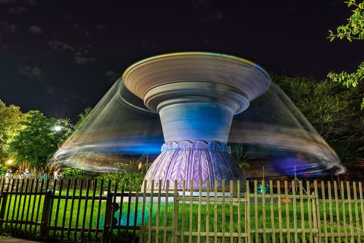 Long exposure of the Monkey Swing Carousel spinning at Casela Nature Park in Mauritius at night