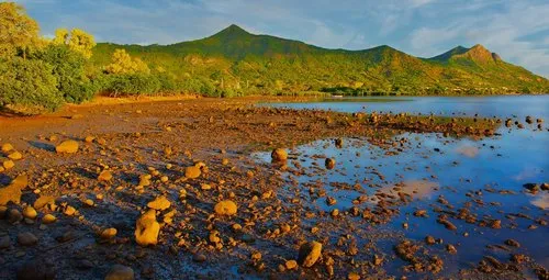 Case Noyale muddy beach at sunset