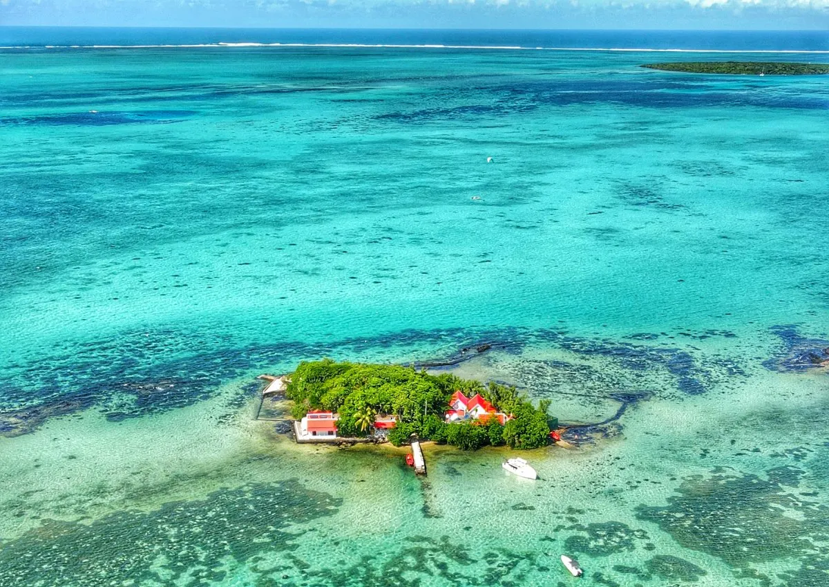 Aerial photo of Le Mouchoir Rouge Island with red-roofed buildings in Mauritius