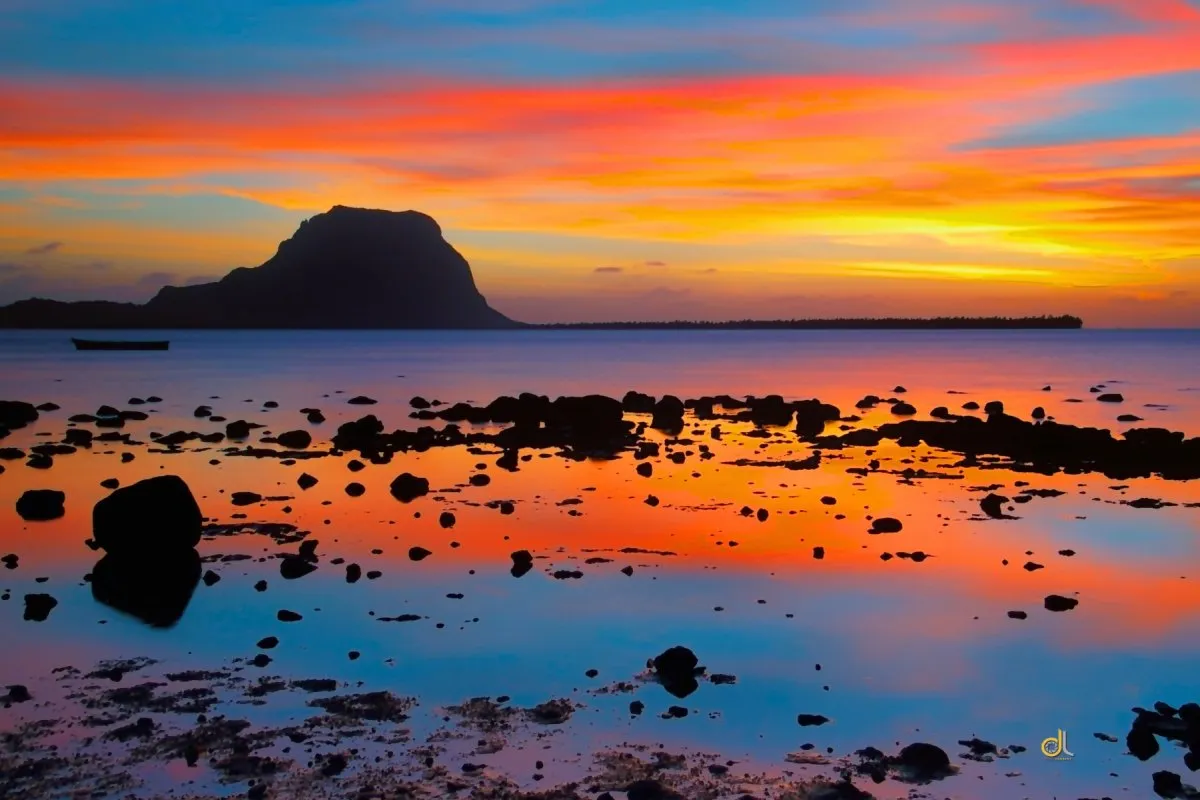 Sunset sky reflecting on the sea at Case Noyale beach in Mauritius