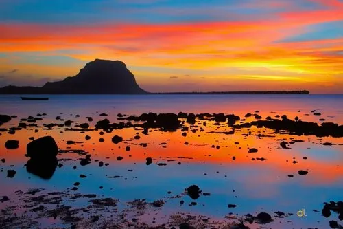 Reflection of sky & sunset at Case Noyale