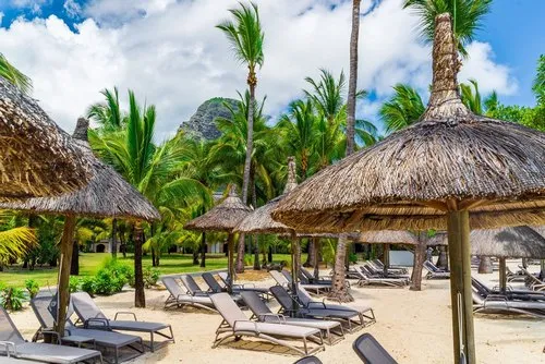 Thatched umbrellas on hotel beach
