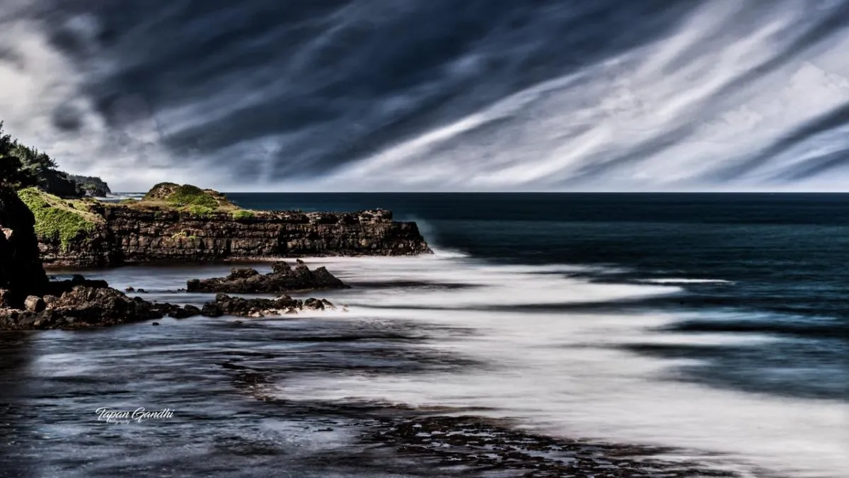 Dramatic sky over Gris Gris cliffs and waves on the coast of Mauritius