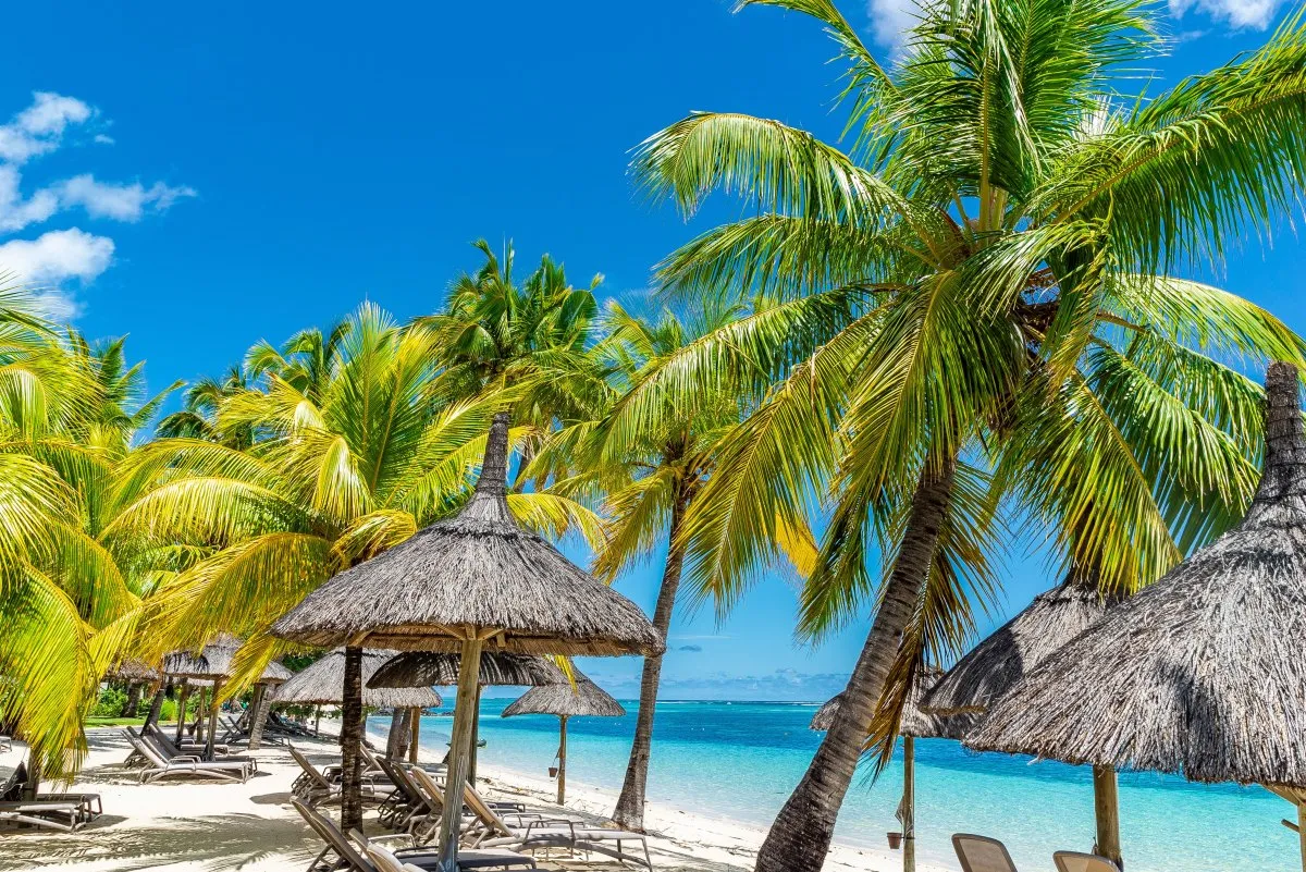 Picturesque lagoon and clear beaches at a luxury resort in Mauritius with turquoise water and lush trees