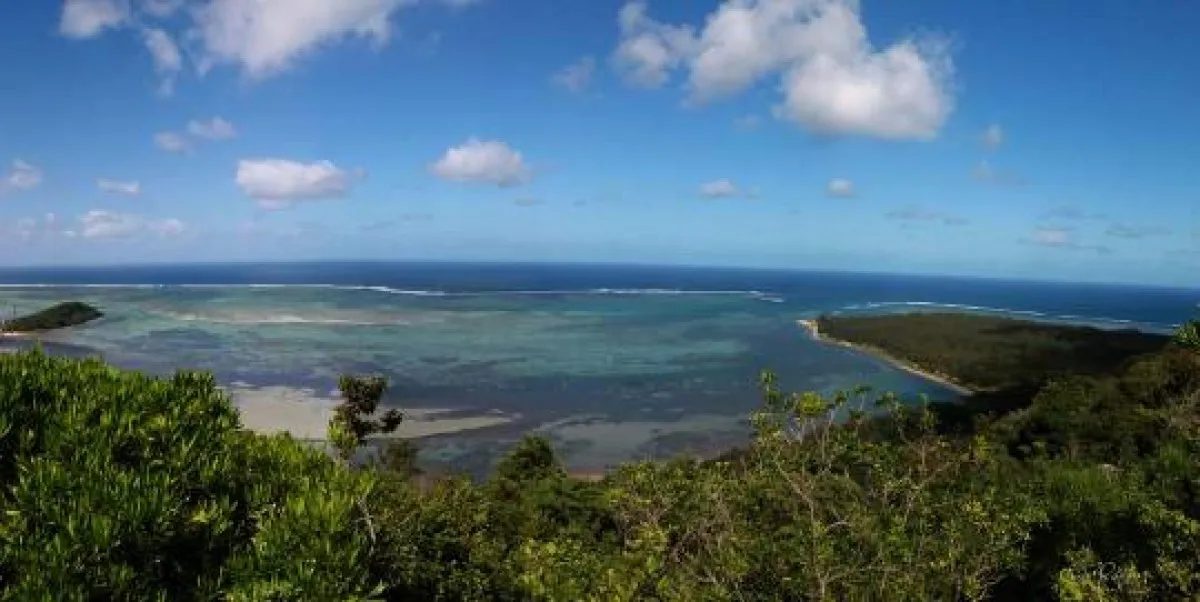 Scenic panoramic view from the top of Le Morne Brabant mountain in Mauritius overlooking lagoons and islets