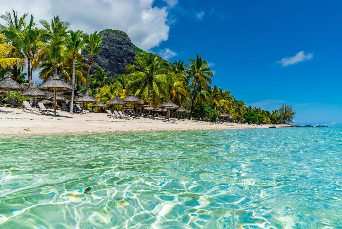Turquoise waters and Le Morne Brabant mountain view from Le Paradis lagoon in Mauritius