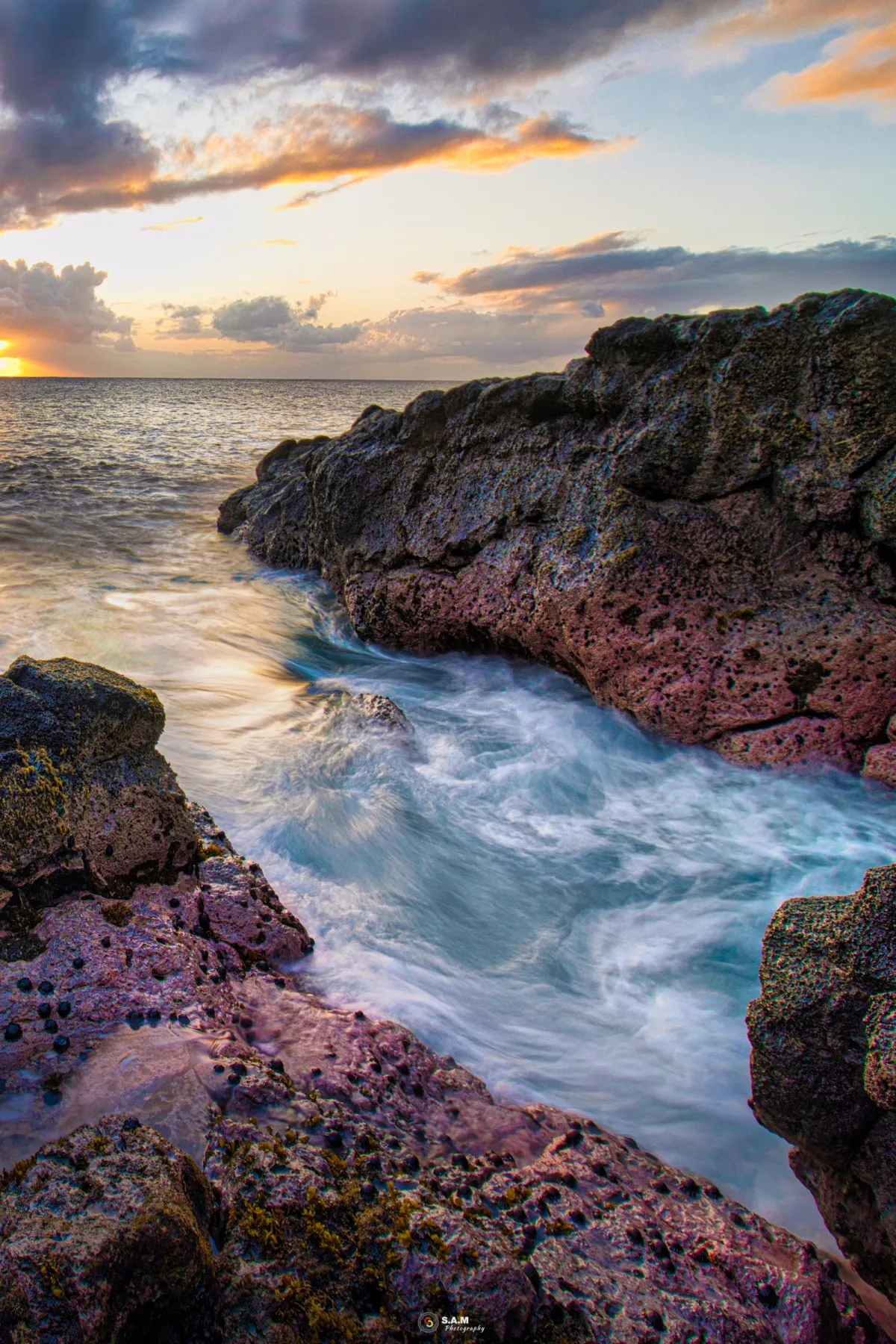 Long exposure photo of slow sea movement with dramatic sky at Albion beach in Mauritius