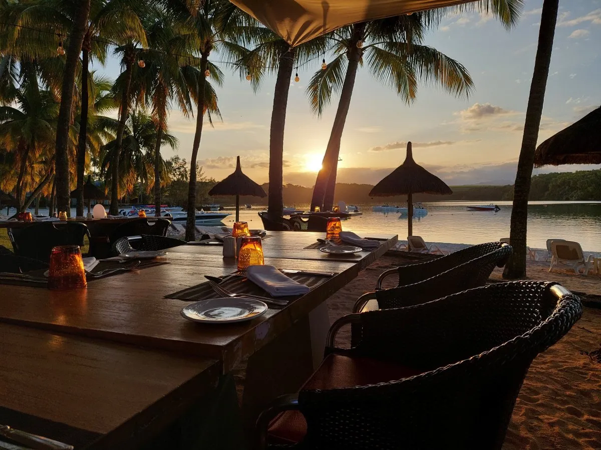 Sunset view over the beach from Le Shandrani hotel restaurant in Mauritius.