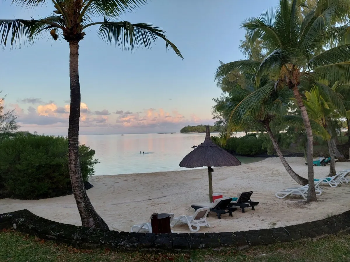 Cozy beach at Le Shandrani Resort and Spa in Mauritius with soft sand and gentle waves