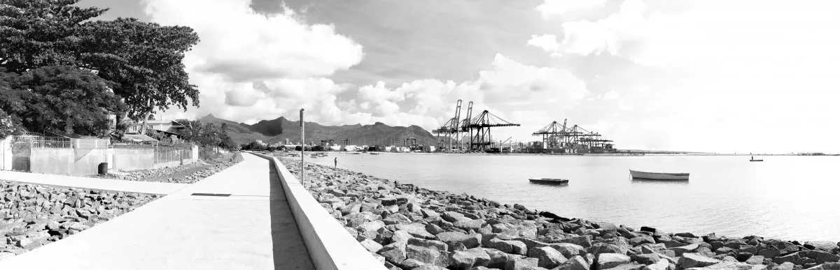 Panoramic view of Port Louis harbor cranes from Baie du Tombeau in Mauritius