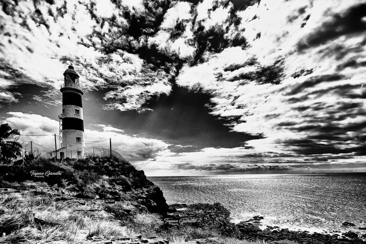 Black and white photo of Albion Lighthouse on cliffs in Mauritius
