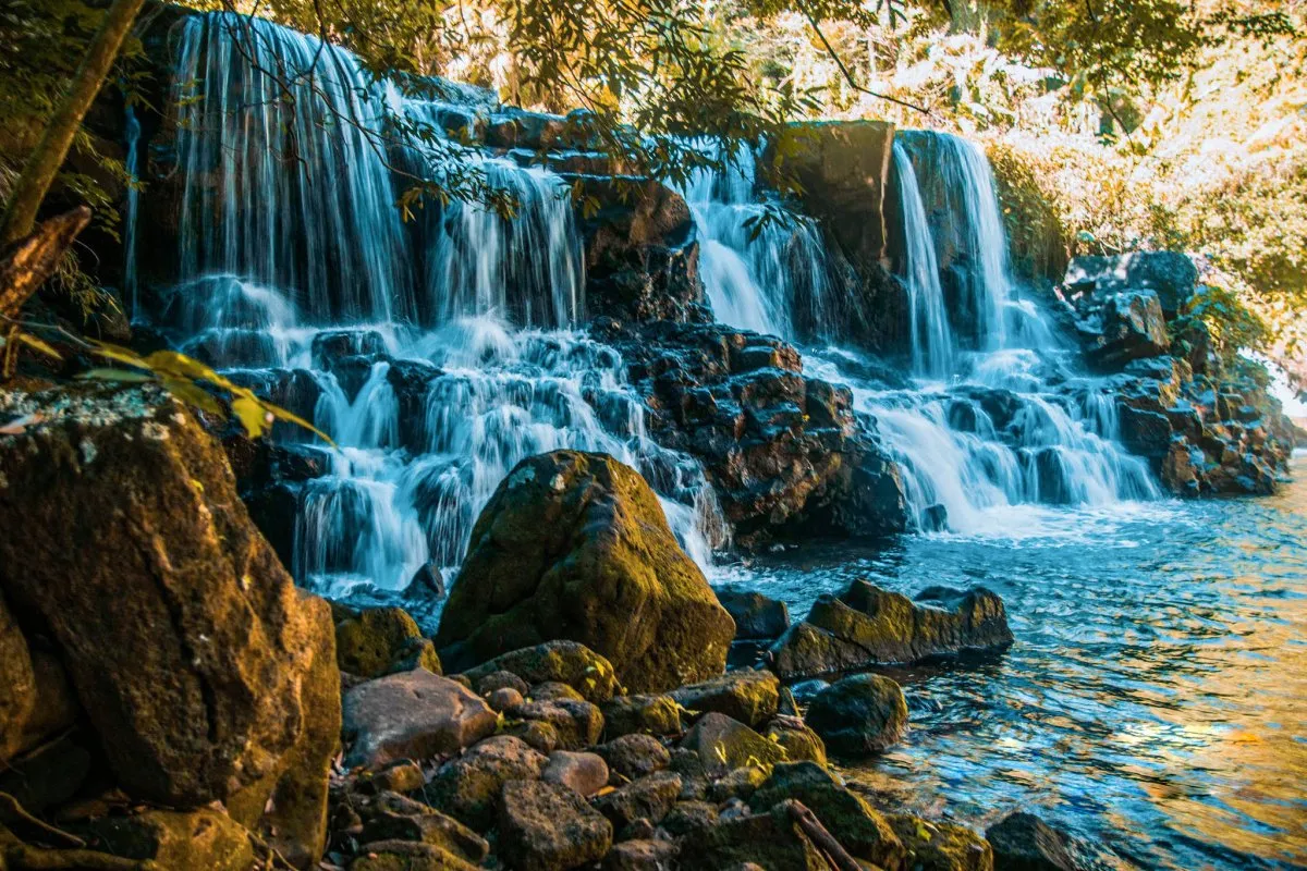 Eureka Waterfall surrounded by tropical trees near La Maison d'Eureka in Moka, Mauritius