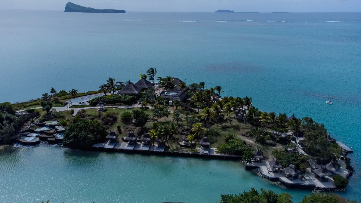 Aerial drone view of Paradise Cove Boutique Hotel with private bay and northern islands in Mauritius