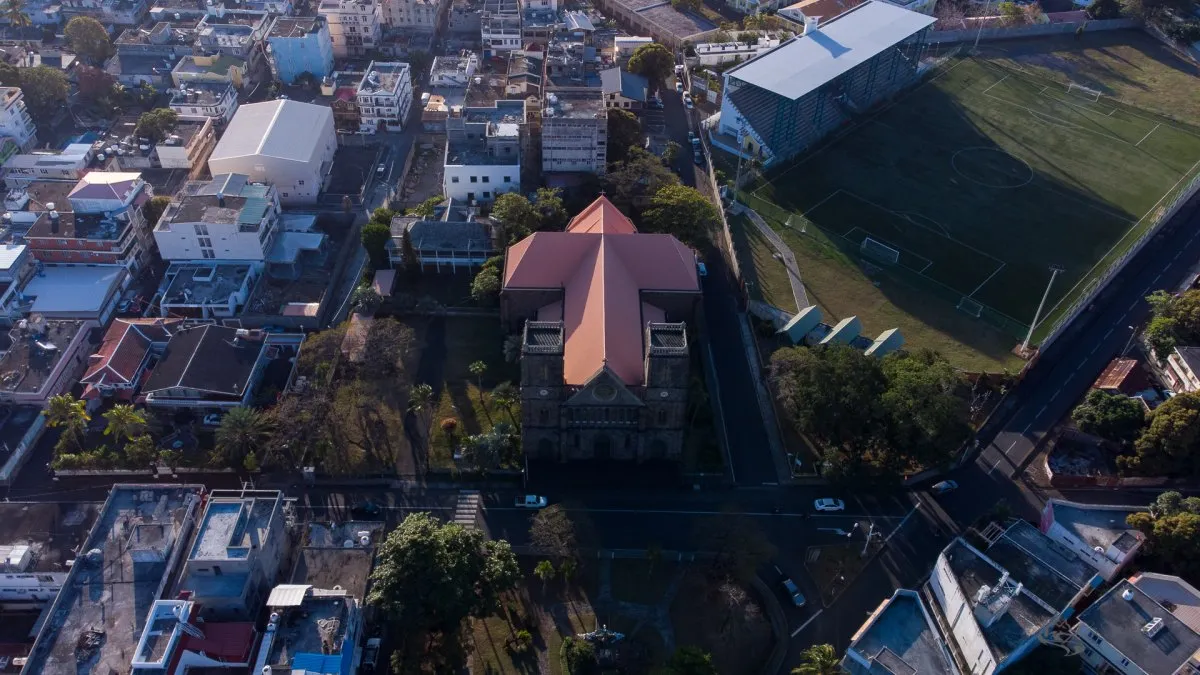 Aerial shot of St François Xavier Church and Stadium with cross-shaped roof in Port Louis, Mauritius.