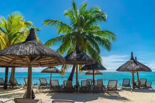 Impressive summer seascape with thatched umbrellas