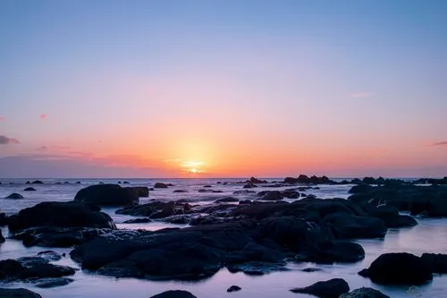 Sun fading behind horizon at flic en flac