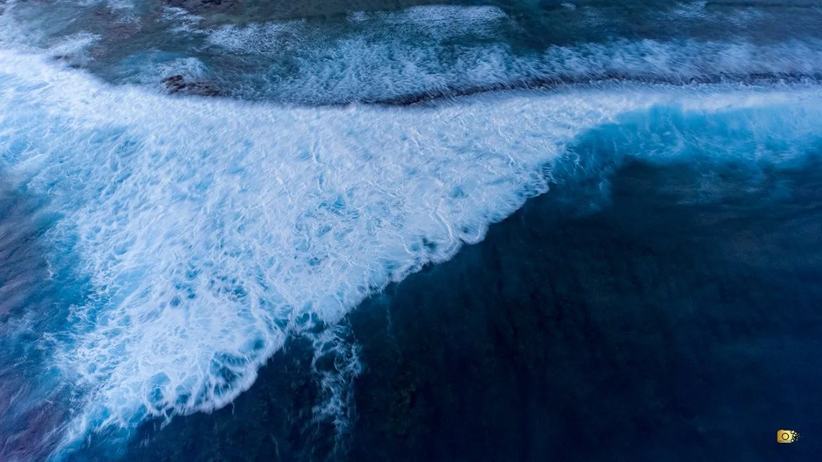 Aerial view of tranquil Pomponette Beach with blue waters and sandy shores in Mauritius