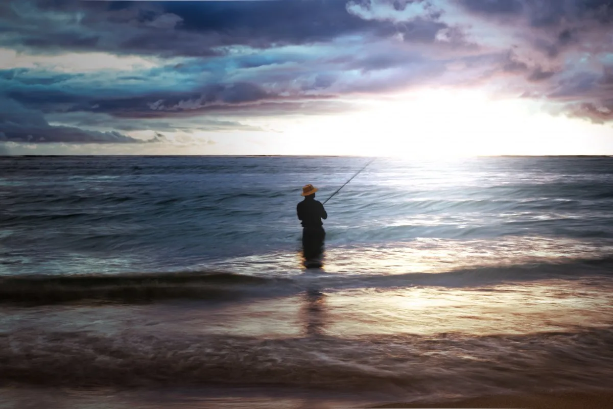 Fisherman at Flic en Flac beach in Mauritius during a calm long exposure shot