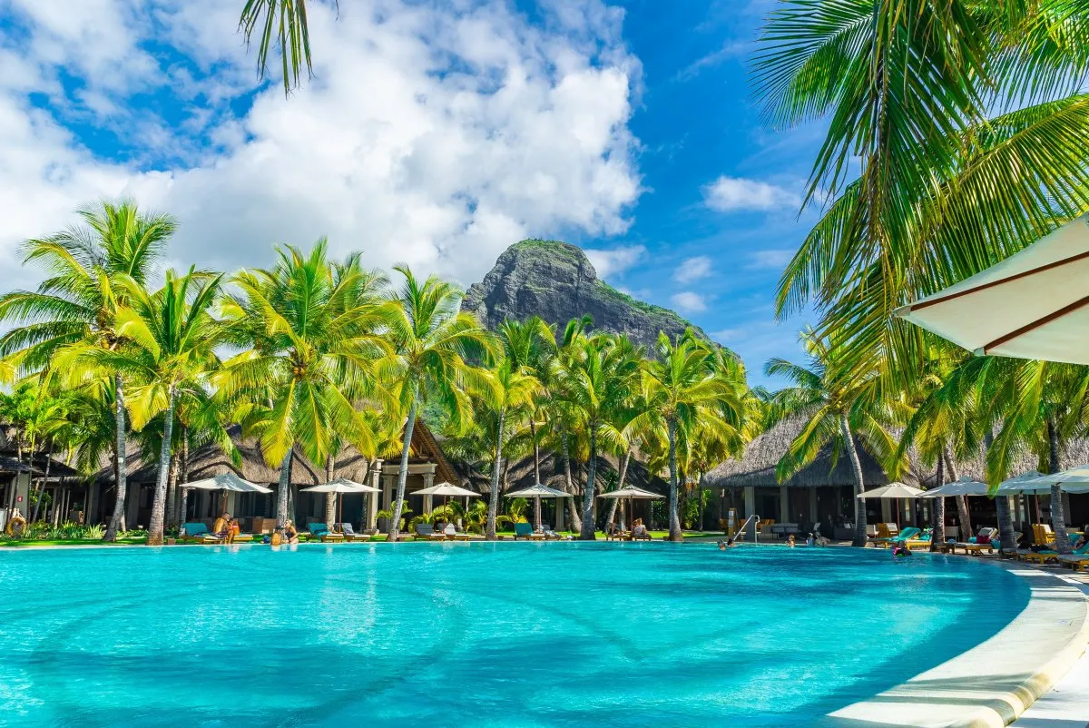 Turquoise pool at Le Paradis hotel with Le Morne mountain in the background in Mauritius
