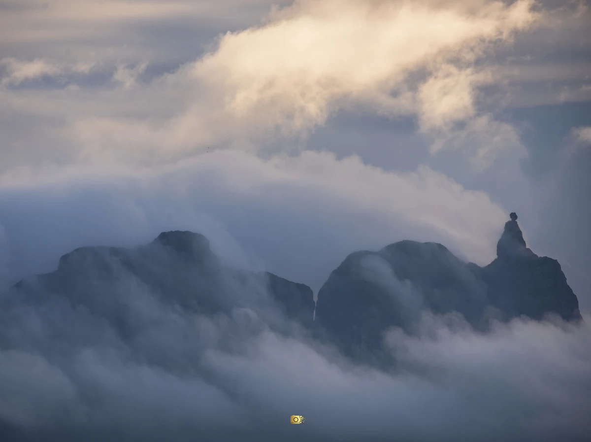 Pieter Both Mountain seen from Côte d’Or in Mauritius, partly covered by clouds and mist.