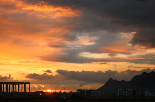 Mountain Silhouette Beneath Dramatic Clouds