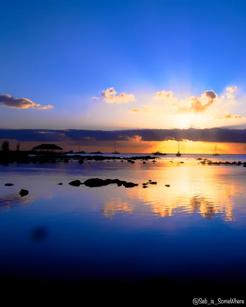 Crepuscular Rays Over Mont Choisy Beach