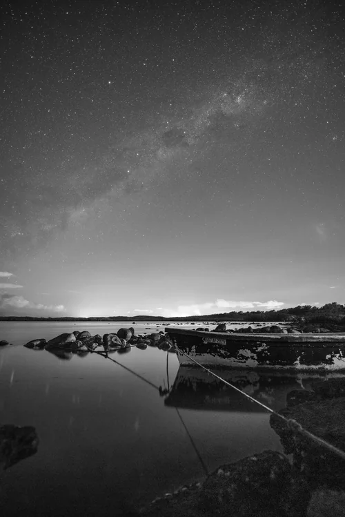 Black and White Milky Way Over a Moored Boat at Poudre d’Or