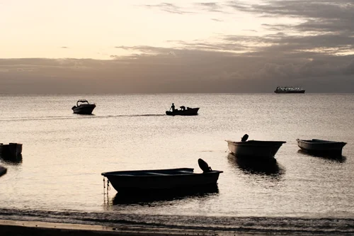 Silhouetted Boats After Sunset at Bain des Dames