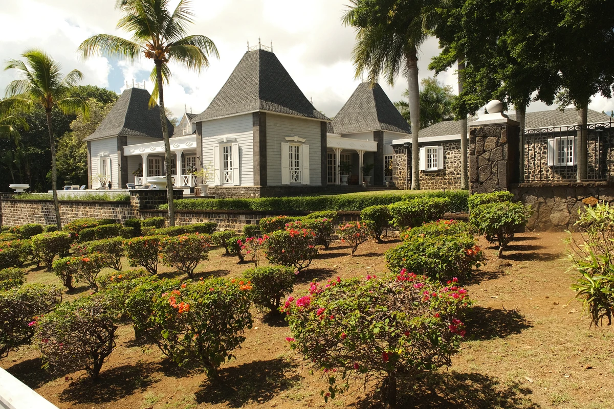 Domaine de Balaclava and Château Mon Désir in Mauritius, with colonial-style architecture, gardens, palm trees and historic estate surroundings.