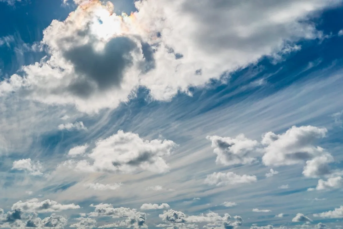 Beautiful white windy clouds on a light blue sky over Mauritius