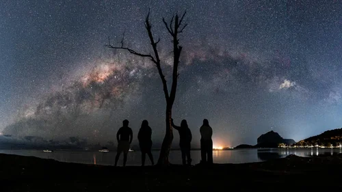 People Beneath the Milky Way on La Prairie Beach