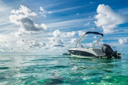 Modern speed Boat in clear turquoise lagoon