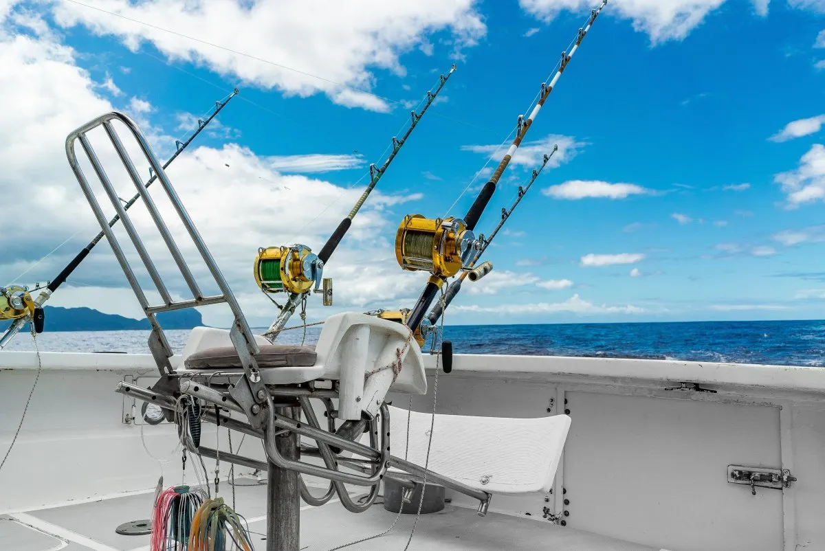 Fighting chair and colorful big-game fishing gear on a boat in Mauritius