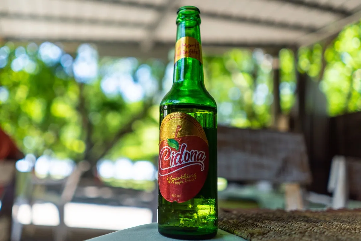 Chilled bottle of Cidona sparkling apple drink popular in Mauritius on a table