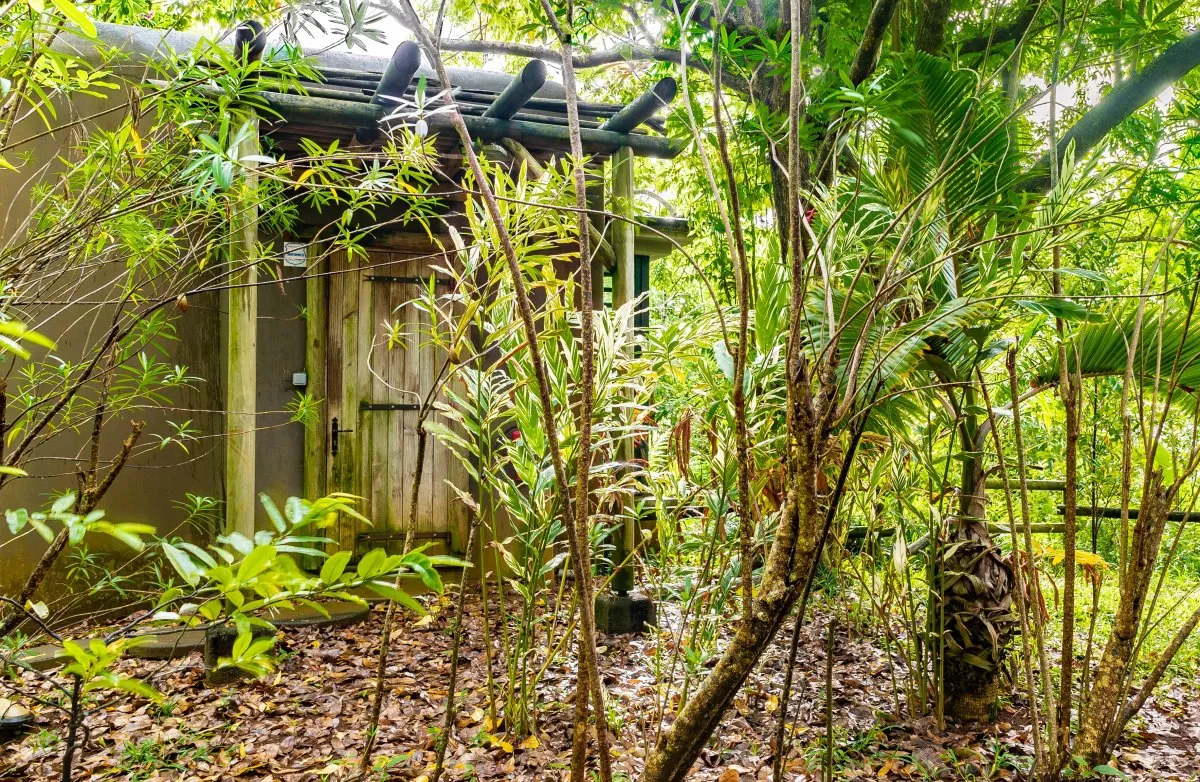 L'Exil lodge room entrance surrounded by lush vegetation in Mauritius