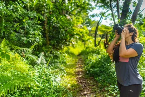 Woman Photographer shooting with DSLR camera