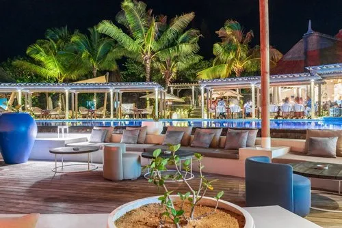 People dining at C beach club restaurant at night