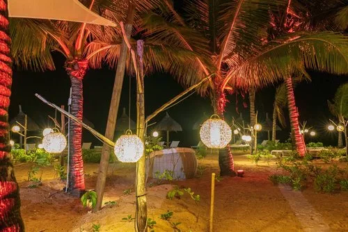 Round outdoor lanterns hanging from wooden pole
