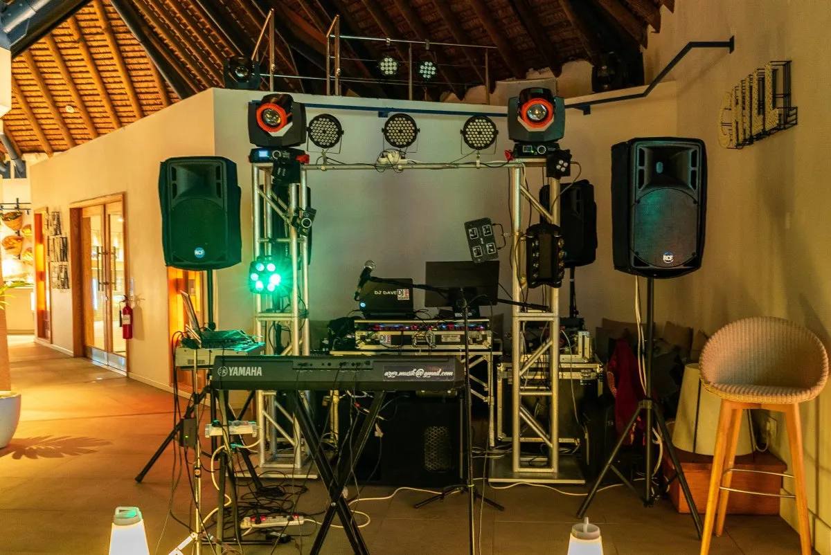 DJ sound system and colorful lighting setup at Heritage C Beach Club beach party in Mauritius