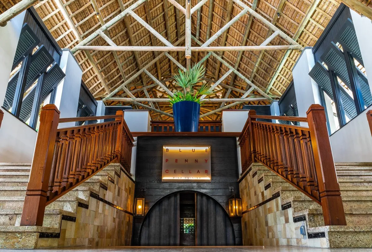 Symmetrical restaurant entry with stairs at Blue Penny Cellar, Constance Belle-Mare Plage, Mauritius
