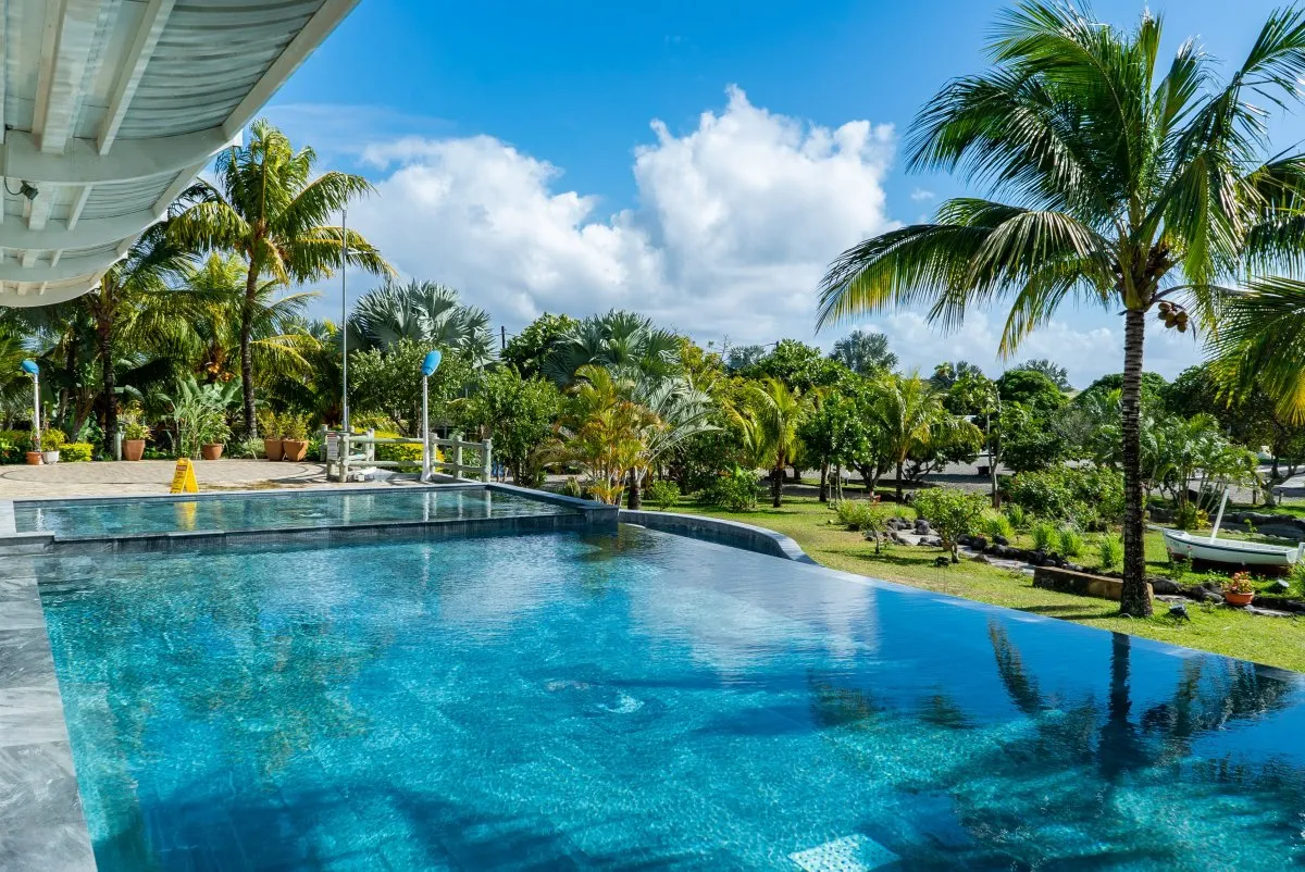 Blue pool at Reve d'R restaurant in Mauritius on a sunny day
