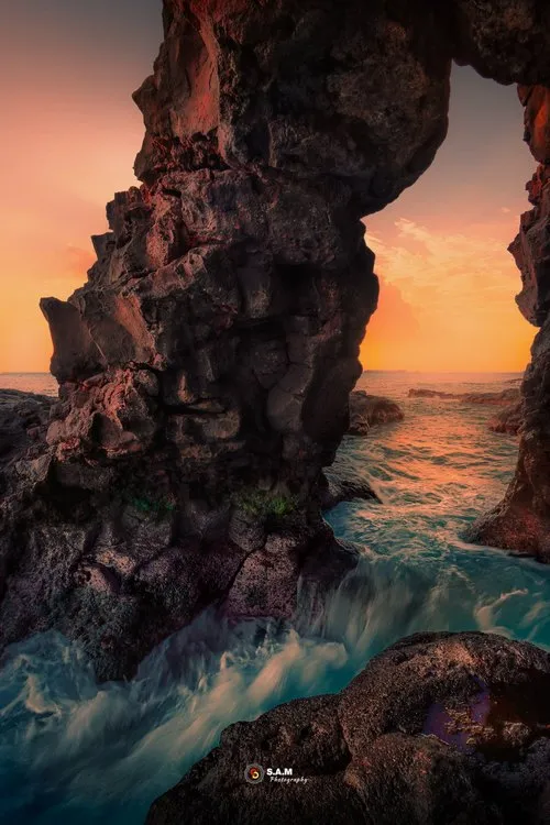 Rock window view over sunset
