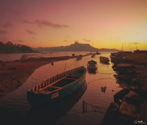 Reddish sunrise in lagoon of Mahebourg