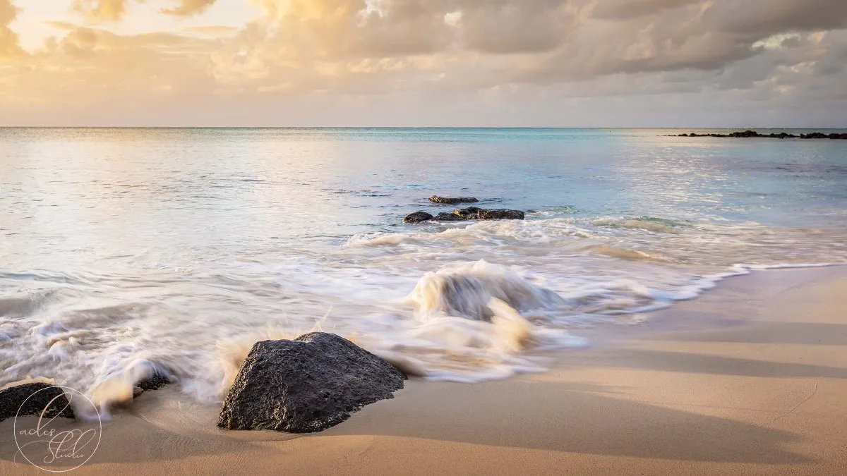 Long exposure photo of sea reaching rocky shore at La Cuvette beach in Mauritius