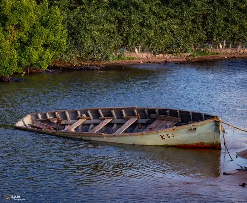 Old sank pirogue in Mahebourg