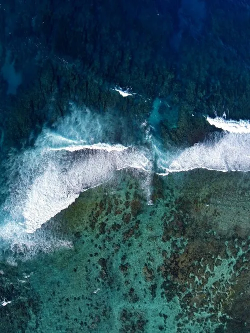 Aerial view of waves & reefs in Mauritius
