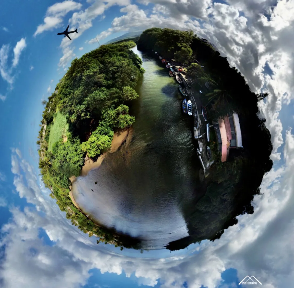 360-degree view of Le Batelage Port with green forest and boats in Souillac, Mauritius