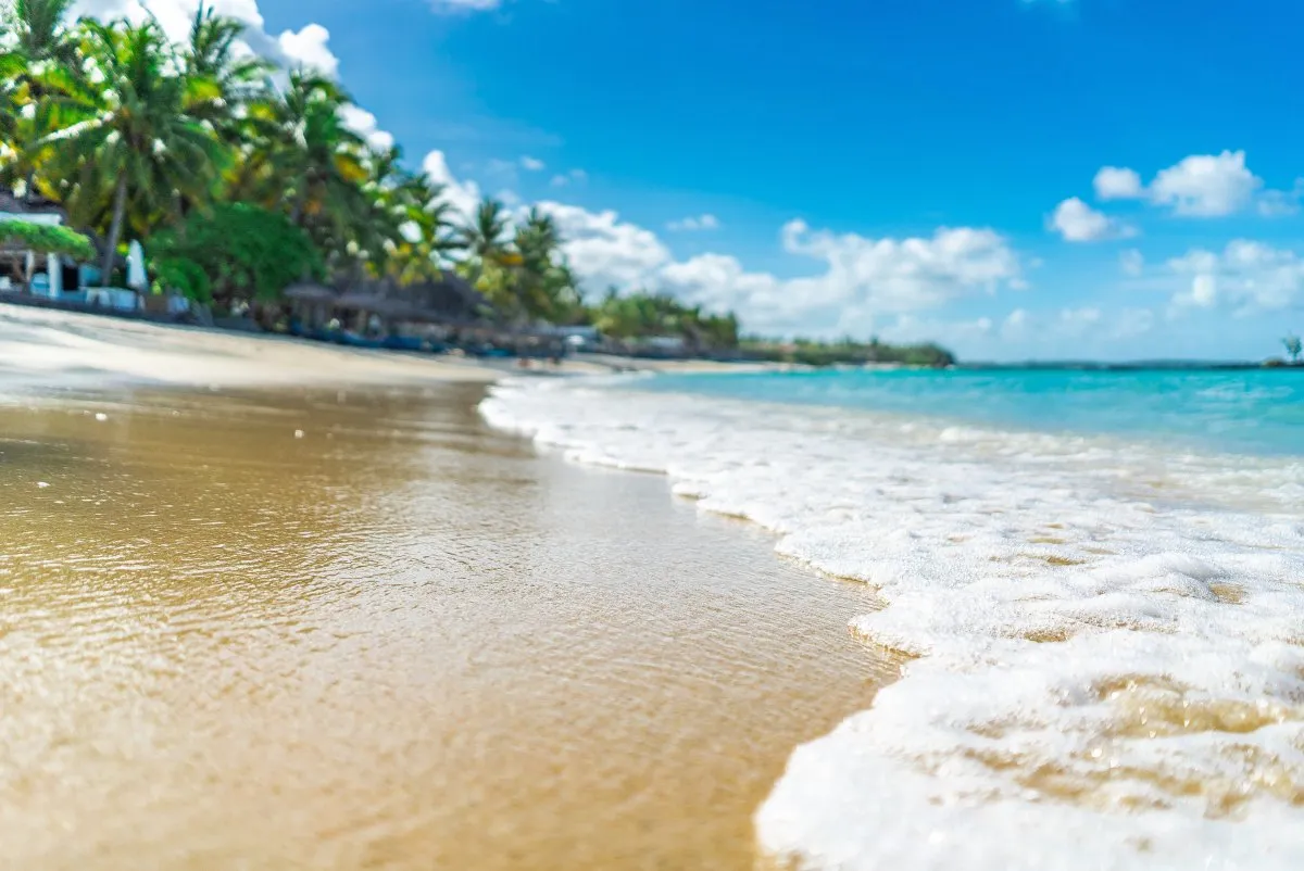 Calm lagoon and white sand beach at Belle Mare on the east coast of Mauritius