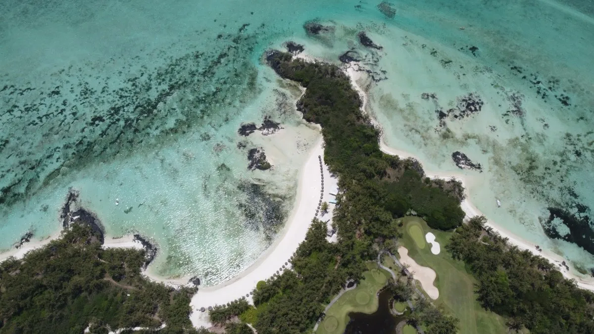 Aerial view of Ile aux Cerfs beach and lagoon in Mauritius with golf course